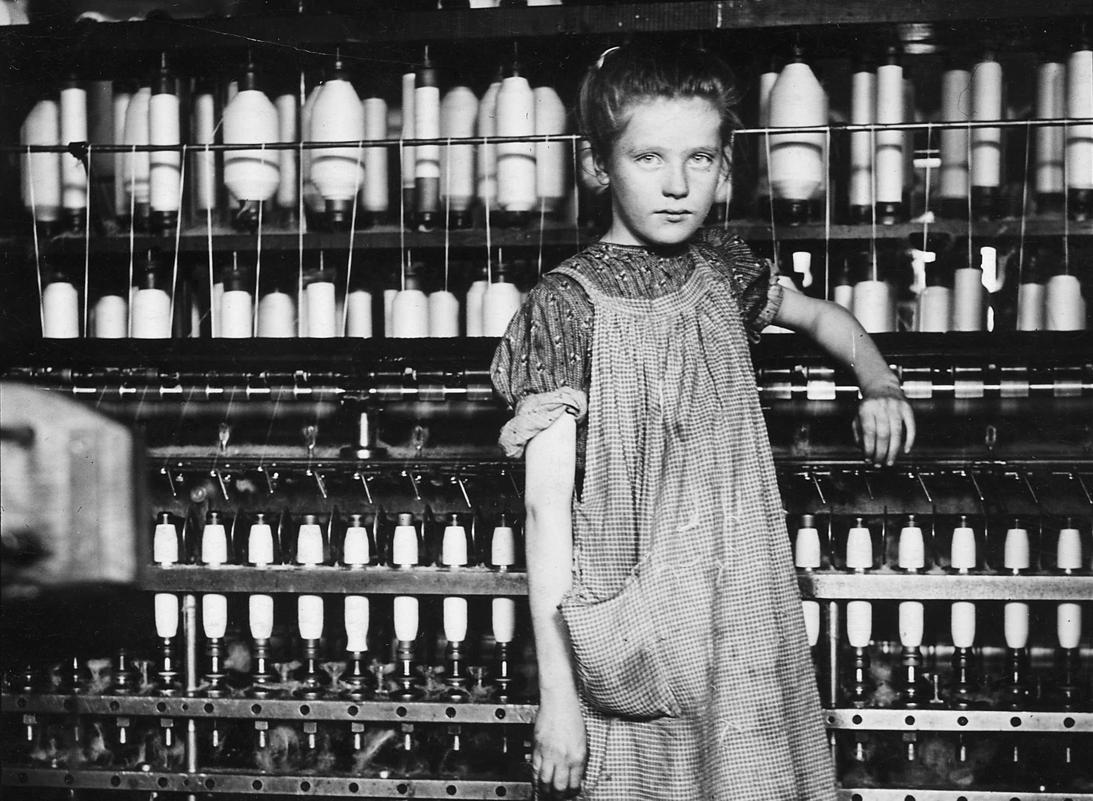 Addie Laird, 12 years old. Spinner in a Cotton Mill. Girls in mill say she is 10 years old, February 1910. Photographer: Hine, Lewis. Original public domain image from Flickr